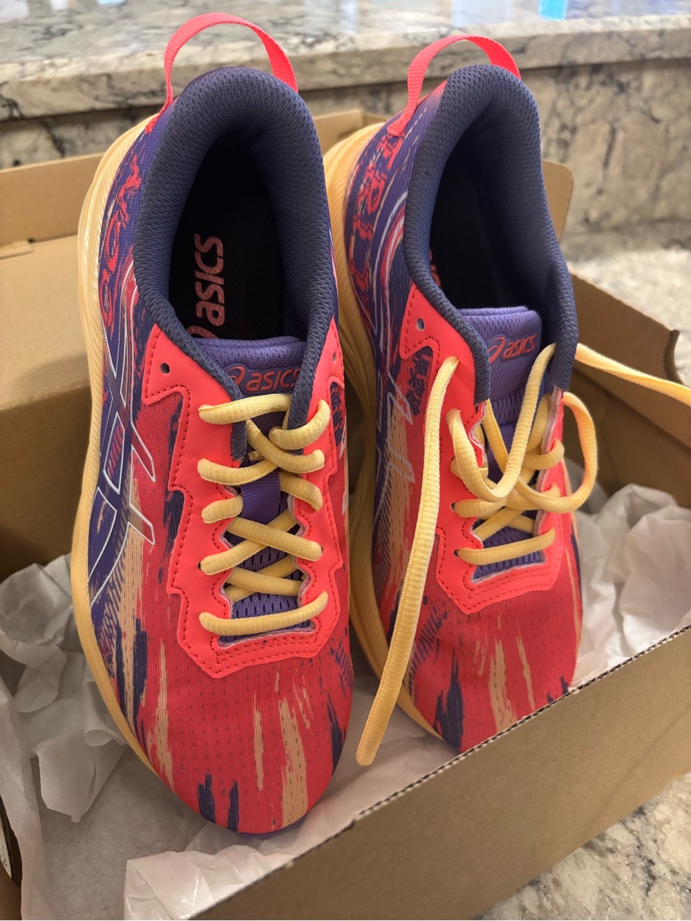 Asics Kids size 4.5/women’s size 6.5Coral, Purple, and Yellow Athletic Sneakers